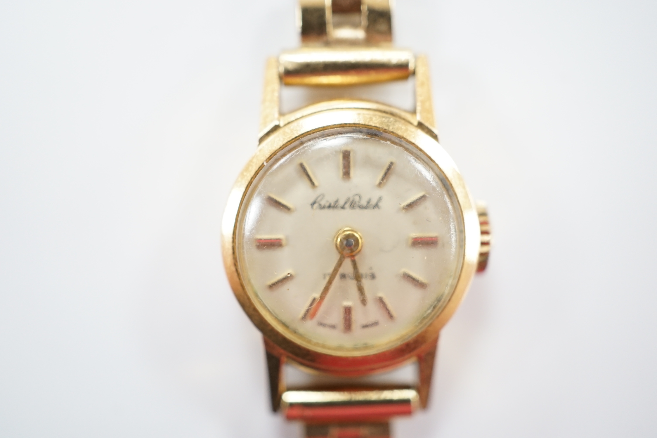 A lady's 18ct gold manual wind Cristal Watch, on a 1960's 9ct gold bracelet, overall length 16cm